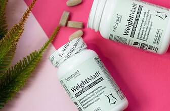 Weight loss supplement capsules on a clean colorful background.