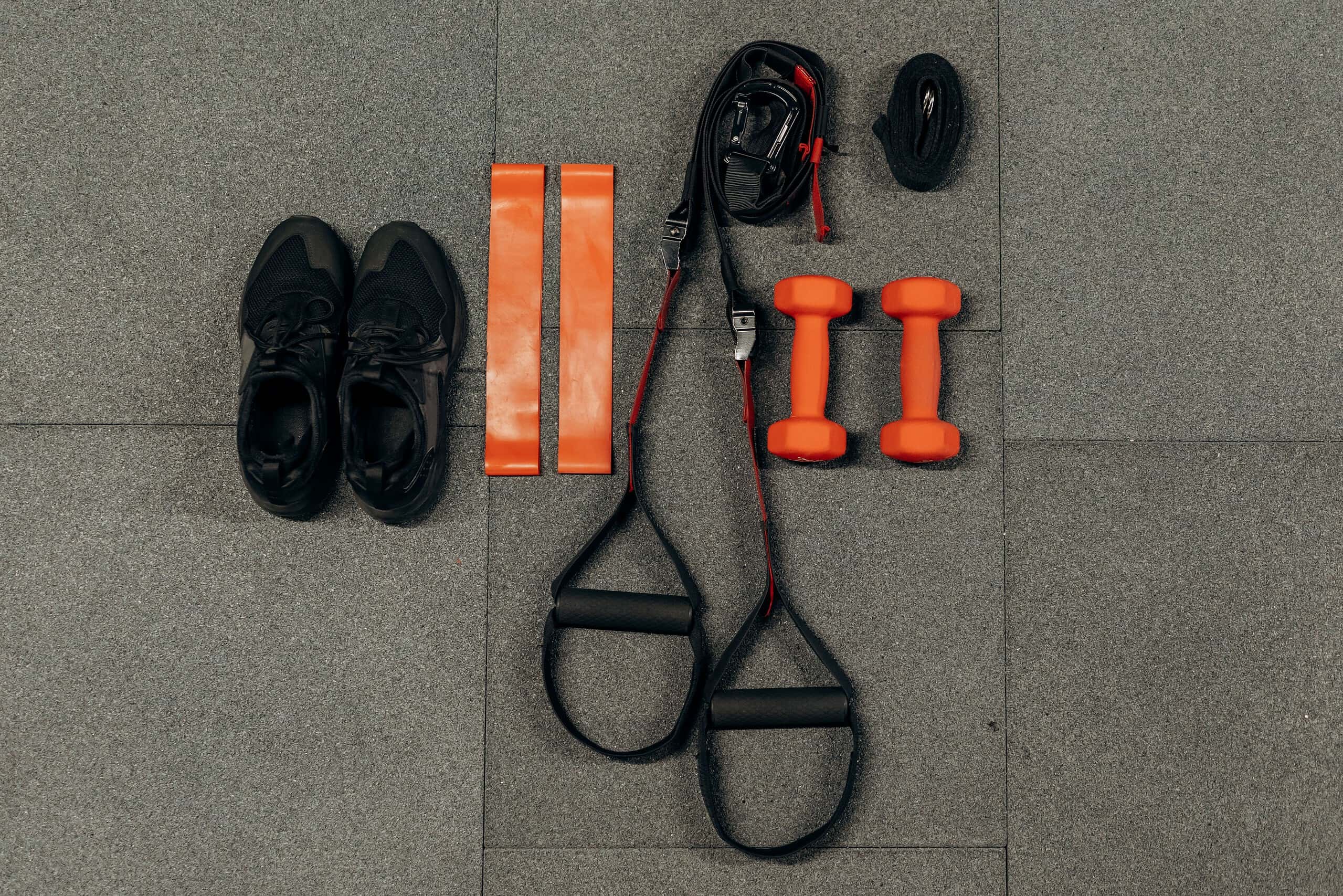 Assortment of fitness gifts arranged on a gym mat.