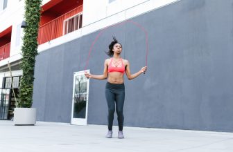 Person jumping rope outdoors during a high-intensity cardio workout session.